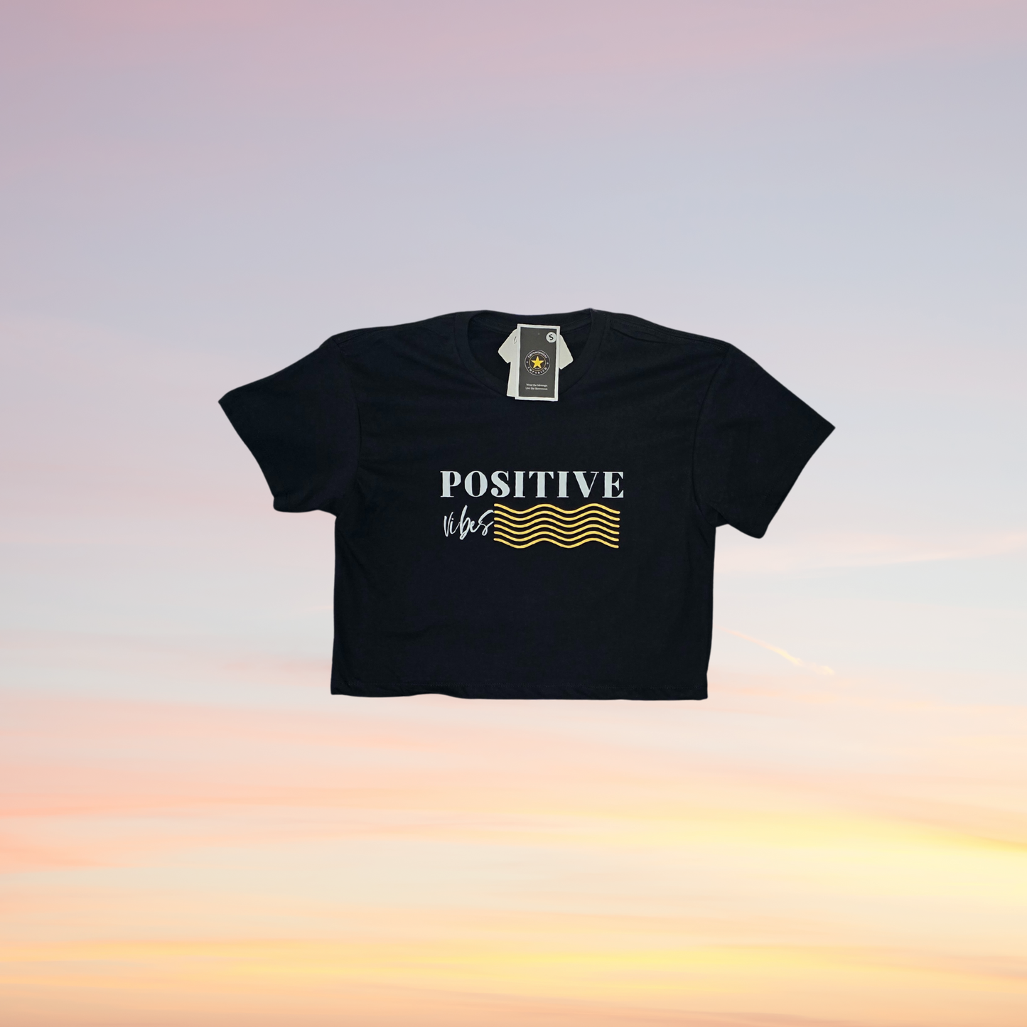 Black crop top with 'POSITIVE' text on a gradient background